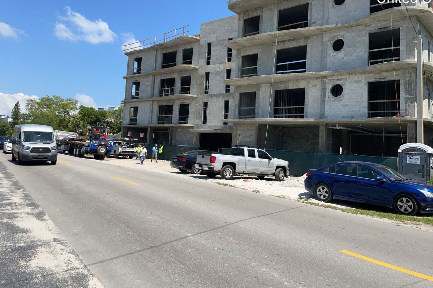 Exterior facade work and scaffold setup on a residential project